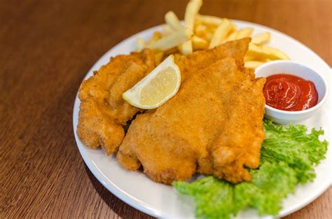 Using the flat side of a mallet, pound the chicken to 1/8 to 1/4 inch thick; How to Make Fried Chicken Schnitzel | Qual Me Foodies Blog