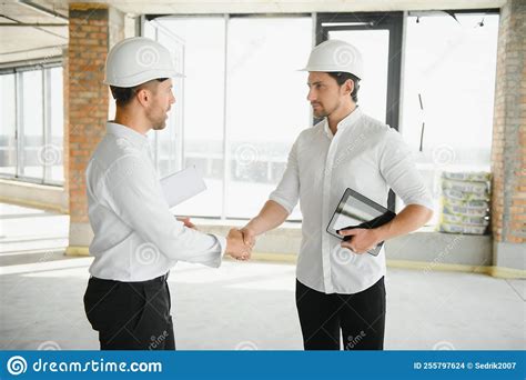 Two Young Man Architect On A Building Construction Site Stock Photo