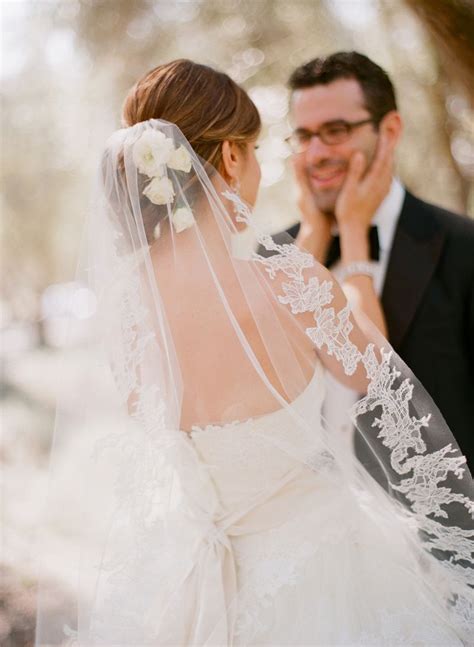 We believe in helping you find the product that is right for you. Low bun with fresh flowers and lace veil | Bridal updo ...