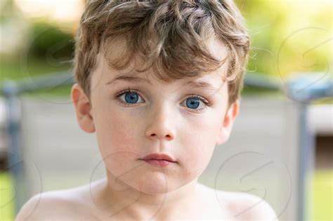 Portrait Of A Young Blue Eyed Boy By Janiece Mulia Photo Stock