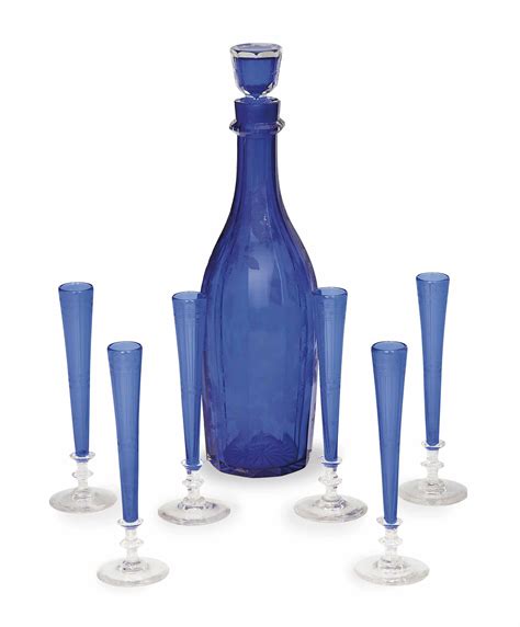 An English Etched Cobalt Blue Glass Decanter And Stopper And Six Cobalt Blue Glass Cordials