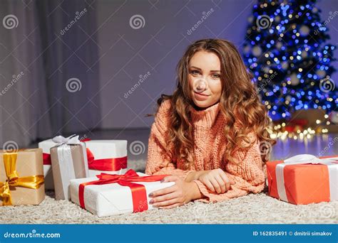 Beautiful Woman Opens Ts At The Christmas Tree At Night At Home New