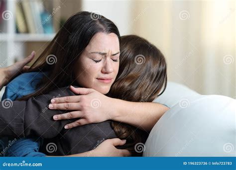 Depressed Woman Hugging A Friend At Home Stock Photo Image Of