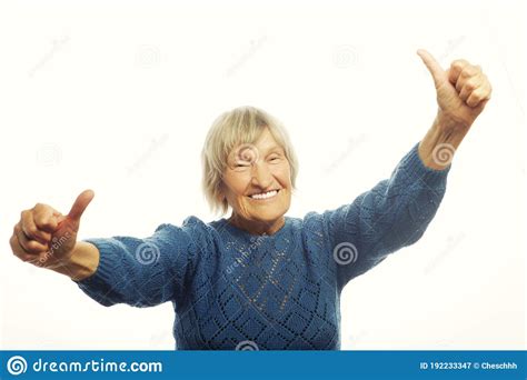 Happy Senior Woman Giving Two Thumbs Up As Sign Of Approval Stock Image