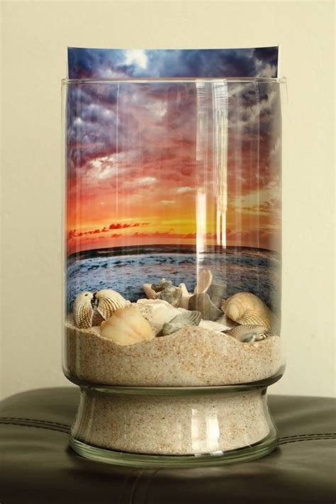 Sand And Sea Shells Against A Sunrise Backdrop In A Jar