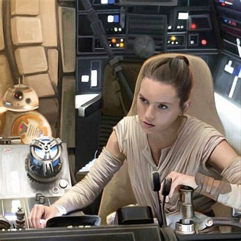 a woman sitting at a desk in front of a star wars scene with lights on