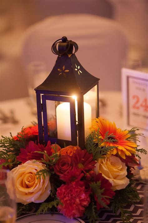 #fallwedding centerpiece lantern | Lantern centerpiece wedding, Lantern centerpieces, Candle glow