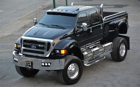 A Black Pickup Truck Parked In A Parking Lot