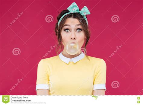 Amazed Cute Pinup Girl Blowing A Bubble Gum Balloon Stock Image 72389053