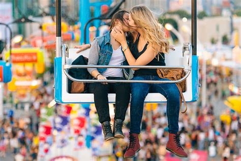 two women kissing on a carnival ride by jen grantham lesbian kiss stocksy united