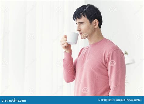 Young Man Drinking Coffee In The Morning Time Concept Wake Up Stock