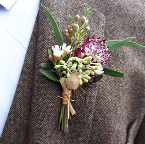 Rustic Buttonhole Of Seeded Eucalyptus Astrantia And Wax Flower