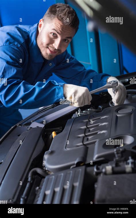Cheerful Handsome Mechanic Working In Auto Center Stock Photo Alamy