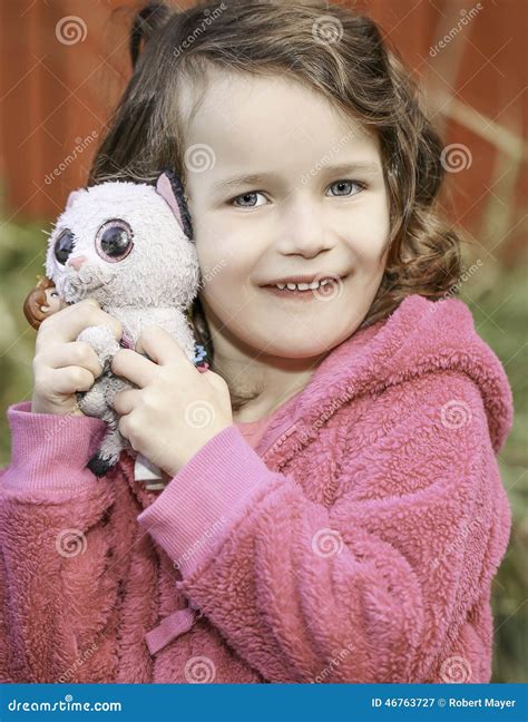 Little Baby Girl Holding Stuffed Toys Wearing Pink Stock Image Image