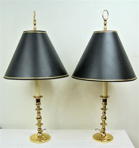 A minimalistic use of negative space, our lamp's hollow center is encircled by antiqued brass. Pair of 25" Baldwin Brass Williamsburg Candlestick Table ...