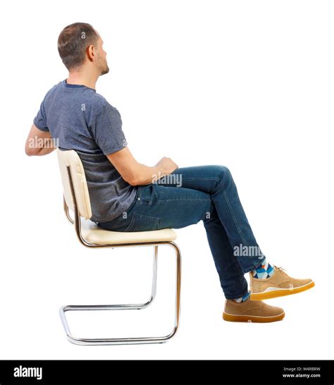 Side View Of A Man Sitting On A Chair Rear View People Collection