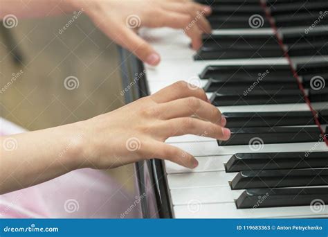 Children S Hands Are Playing The Piano Child S Hand On Piano Keys