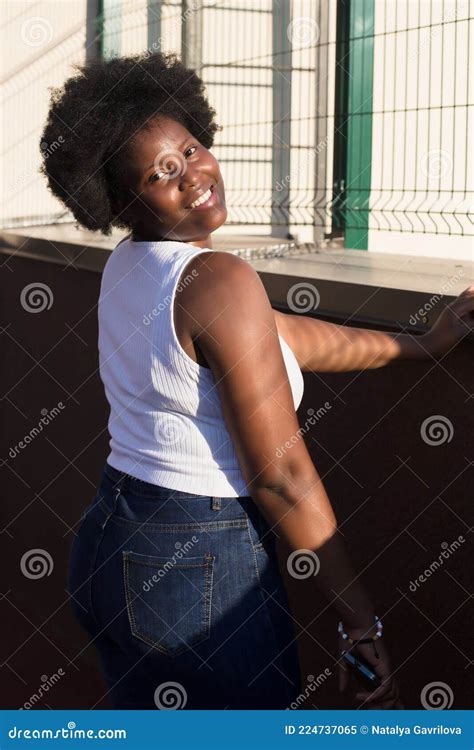 Portrait Of A Happy African American Woman On The Street In Summer