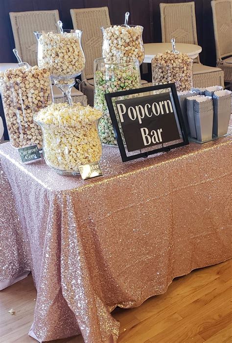 Popcorn Buffet In Large Glass Candy Jars With A Blush Sequin Wedding