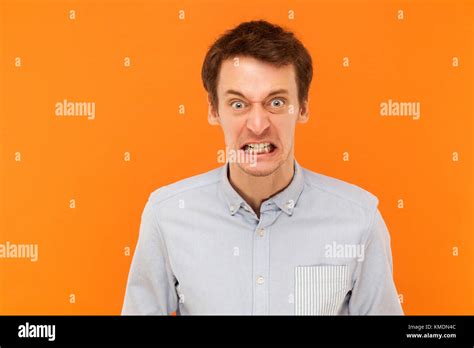 Anger Man With Big Eyes Looking At Camera Studio Shot Stock Photo Alamy