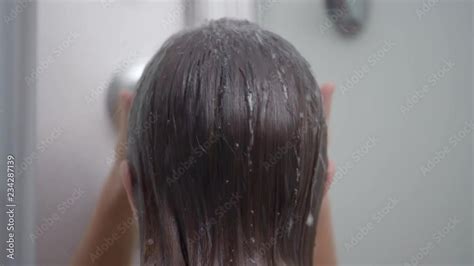 Young Girl Bathing Under A Shower At Home Back View Beautiful Teen
