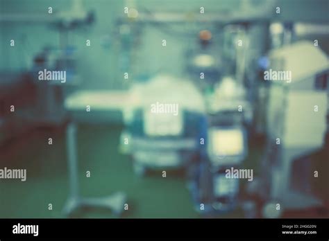 Unfocused Background With Comatose Patient In The Advanced Equipped Icu