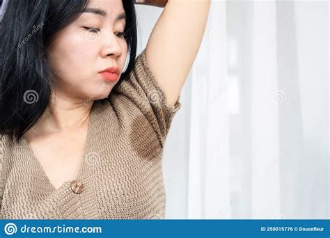 Asian Woman Having Problem With Sweat Smelly Armpit Stock Photo