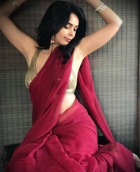 mallika sherawat hot images in maroon saree