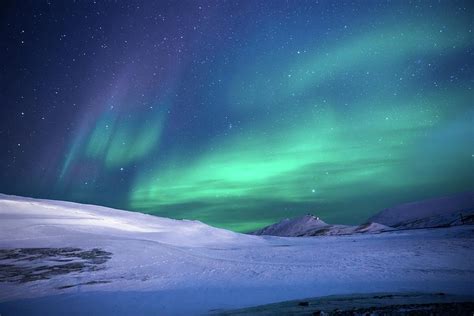 Aurora Borealis Over Snowy Mountain Landscape Photograph By Graal