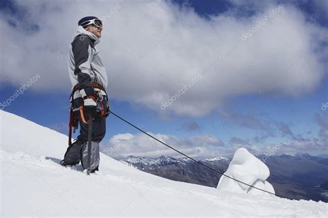Mountain Climber On Snowy Slope Stock Photo By ©londondeposit 33835137