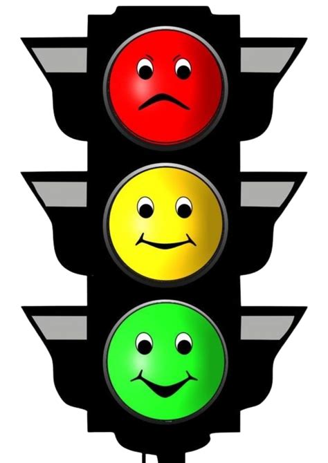 A Traffic Light With Three Different Faces On The Red Green And Yellow