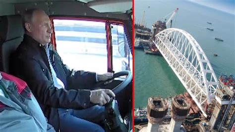 vladimir putin leads convoy of trucks over controversial 12 mile bridge as he officially opens