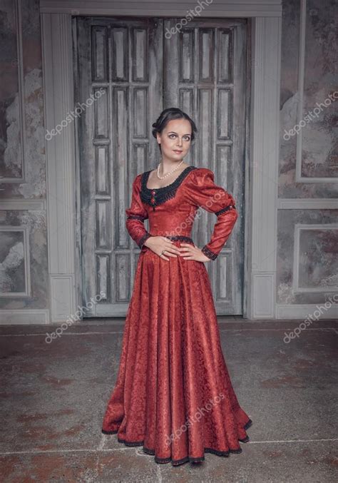 Beautiful Woman In Red Long Medieval Dress Stock Photo By ©darkbird