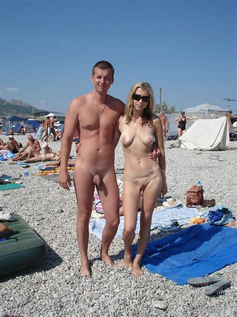 Nudist Couple Posing For The Photo Camera At Beach