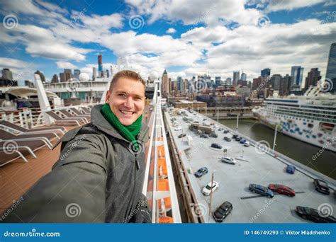 Young Man Makes Selfie With Huge Cruise Ship And New York City On