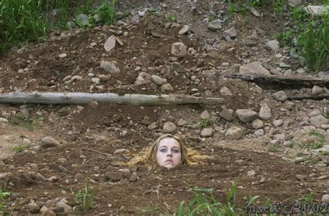 Woman Buried Up To Her Neck In The Ground Плакат