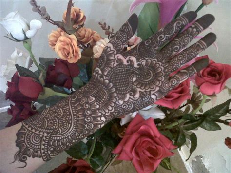 The design is made up of several patterns ranging from flowers and paisleys to checks to beaded hangings. Stylish Full Hand Bridal Mehndi Designs - Mehndi Designs