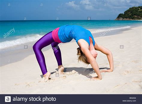 Women Yoga Bending Over Stock Photos And Women Yoga Bending Over Stock