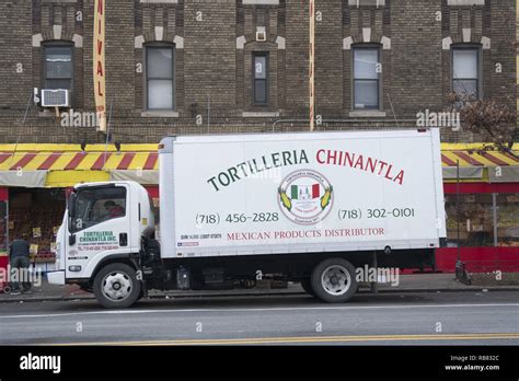 Delivery Truck Of Mexican Food Products Parked On The Street In