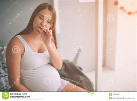 pregnant woman enjoying of eating chocolate at home stock image image of eats hand 107745655