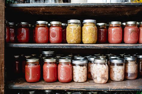 Home Canning Fruit And Vegetable In Storage Shelves Stock Photo