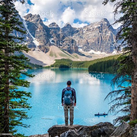 Hiker Looking At View At Moraine Lake In Banff National Park Alberta Canada Stock Photo