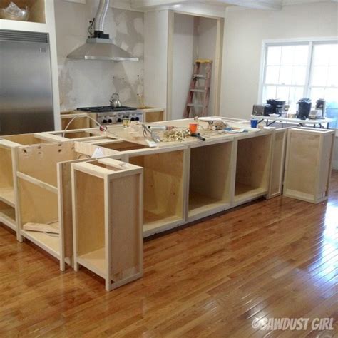 Install base & wall kitchen cabinets. Kitchen Island - Sawdust Girl®