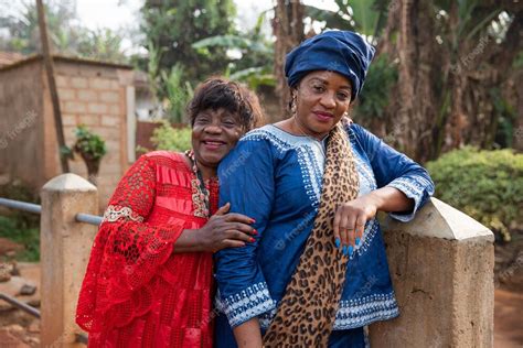 Premium Photo Two Mature African Women Hug Each Other They Are Dressed In African Clothes