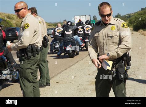 A Sheriffs Deputy From The San Diego Sheriffs Department Secures A Knife That Was Removed From