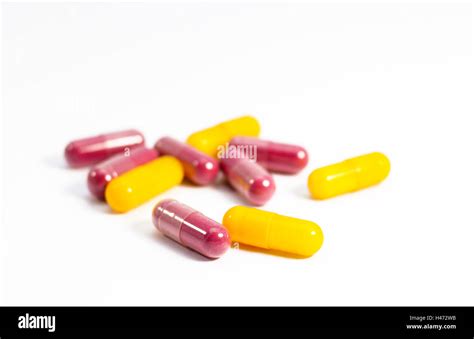 Red And Yellow Capsules With White Background Stock Photo Alamy