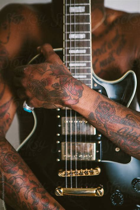 Young Tattooed Black Man Modelling With Guitar By Kkgas Stocksy United