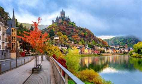 Fall in love with the stunning natural beauty, traditional architecture and storybook castles where the moselle meets the rhine.; Cochem town in autumn colors, Moselle valley, Germany ...