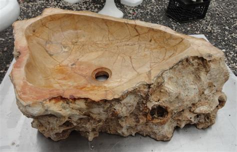 Why are there rocks in the bottom of the sink? Carved Stone Sink | Recycling the Past - Architectural Salvage
