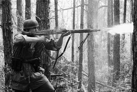 A German Paratrooper Firing A Mg42 The Standing Position Was Not